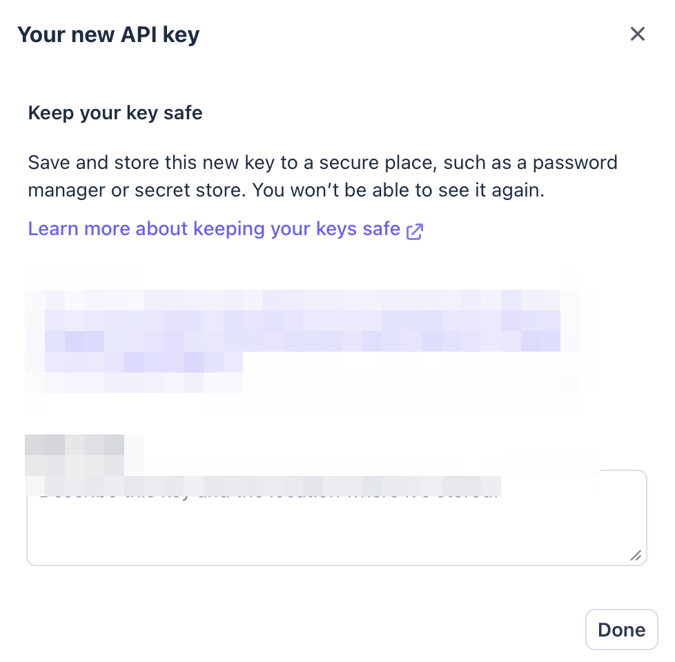 Stripe's one-time key reveal dialog: Your new API key, with the rk_live key shown once and a warning that it can't be viewed again